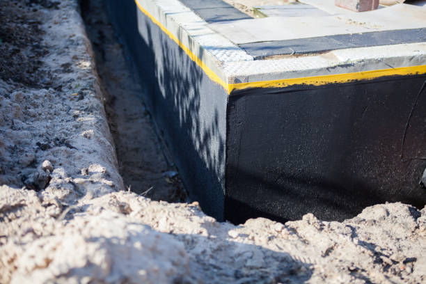 Professional Waterproofing technician working in Henrietta, NY